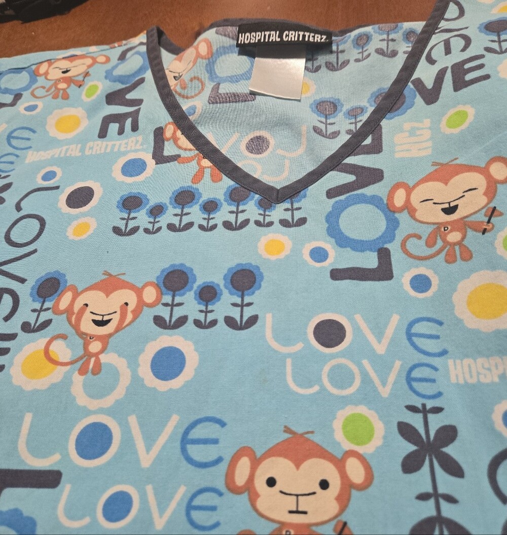 Ladies Scrub Top  In Blue Monkey Print SIze Large